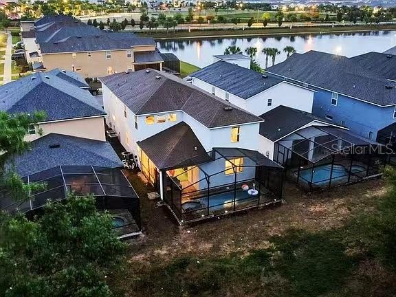 1919 Tropical Palms Circle Kissimmee, FL 34747 - Photo 9 of 41 an aerial view of a house with swimming pool and outdoor seating