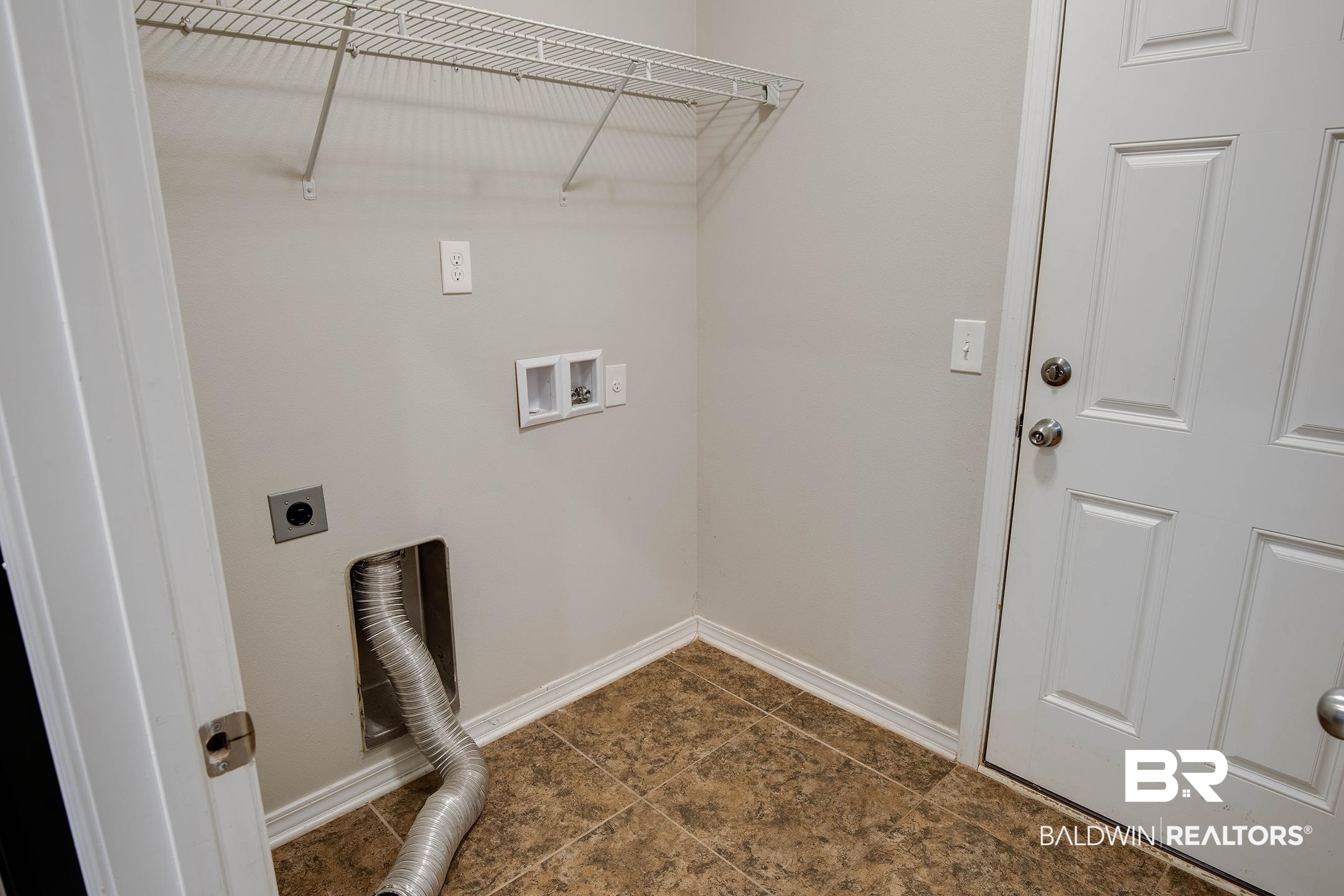15345 Fremont Court Foley, AL 36535 - Photo 17 of 35 Washroom with dark tile patterned floors, washer hookup, and hookup for an electric dryer