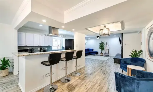 a kitchen with counter top space cabinets and stainless steel appliances