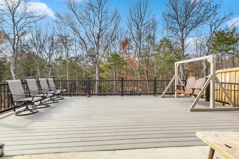 a kitchen with stainless steel appliances kitchen island granite countertop a refrigerator and a stove top oven