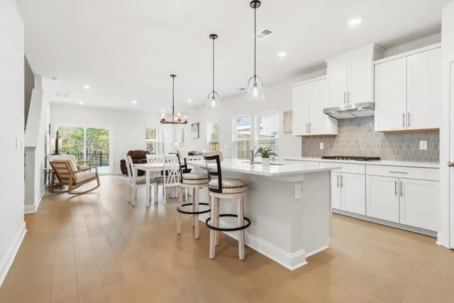 a bedroom with a bed chair and window