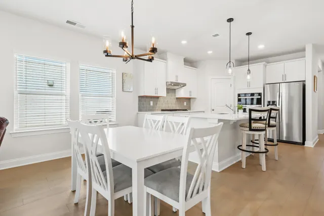 a bathroom with a granite countertop sink a toilet and a mirror