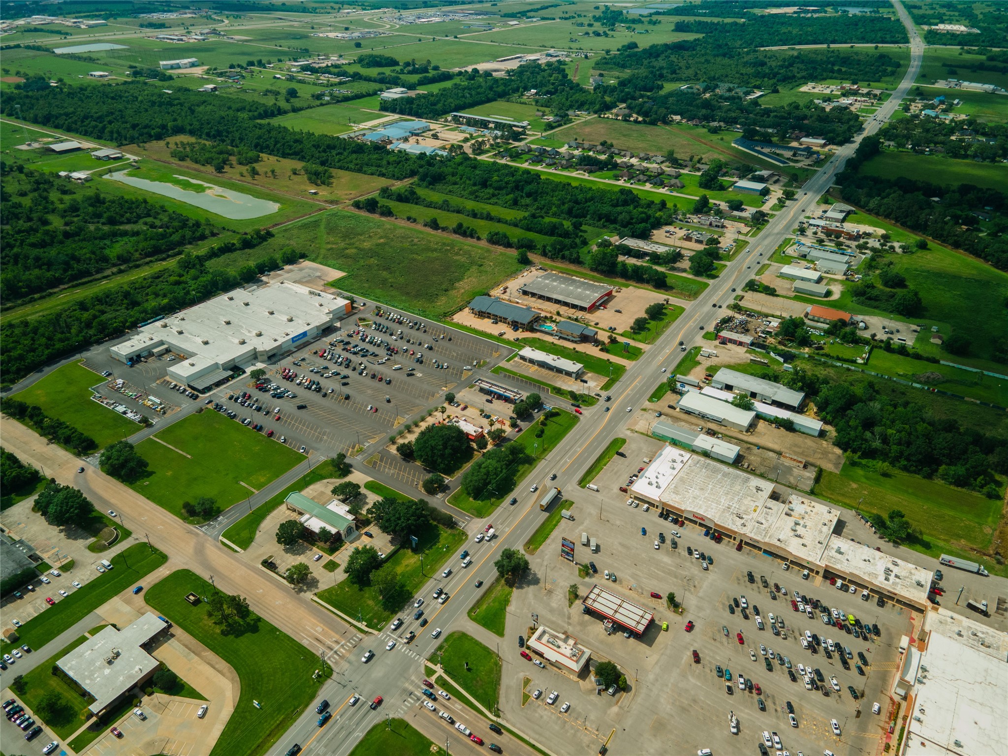 0 Karankawa Street Angleton, TX 77515 - Photo 17 of 22 a view of a city with a lush green forest