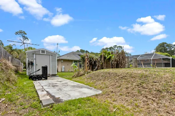 a view of a house with a yard and garage