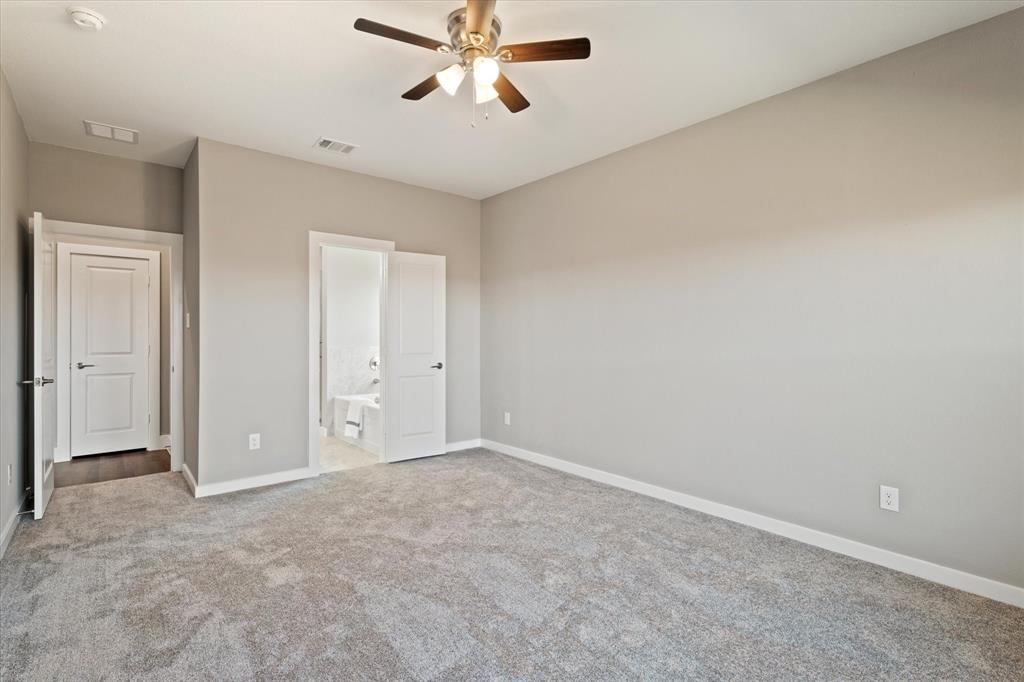 434 Cirrus Circle Muenster, TX 76252 - Photo 15 of 29 an empty room with windows and fan