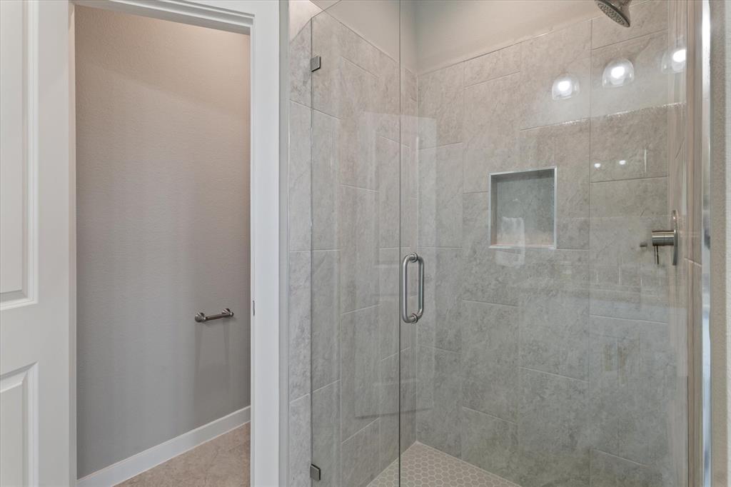 434 Cirrus Circle Muenster, TX 76252 - Photo 17 of 29 a bathroom with a shower