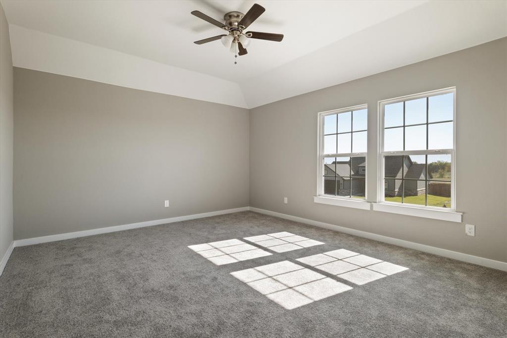 434 Cirrus Circle Muenster, TX 76252 - Photo 25 of 29 an empty room with windows and ceiling fan
