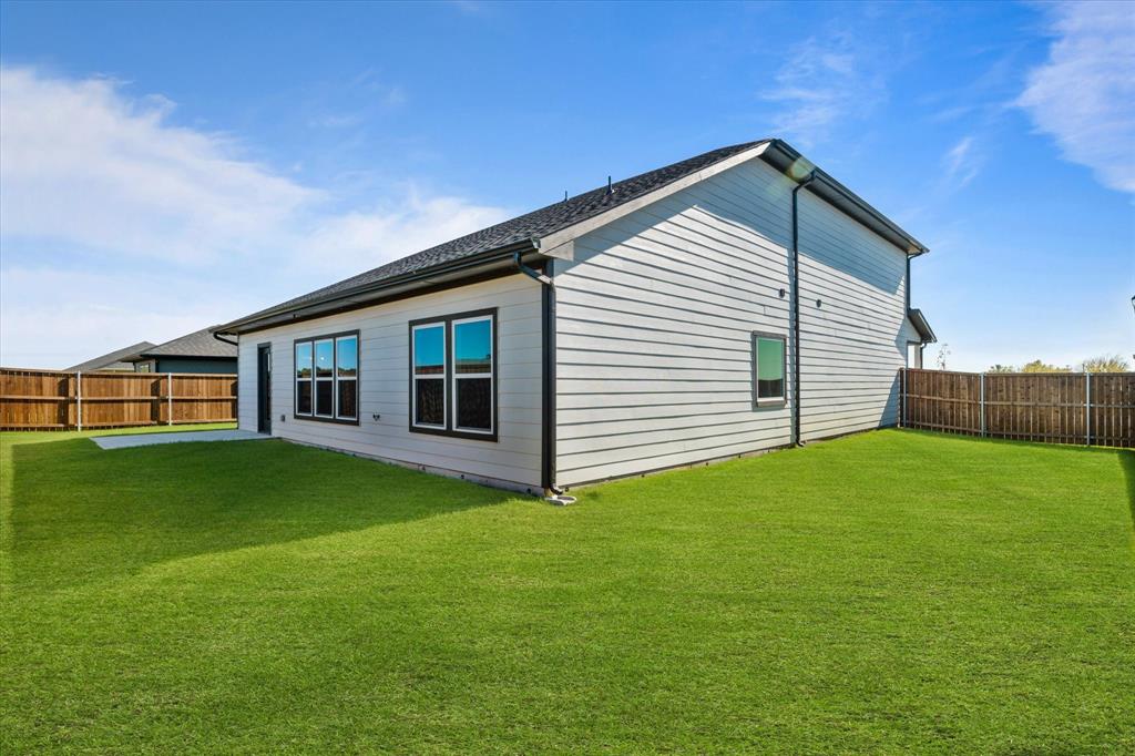 434 Cirrus Circle Muenster, TX 76252 - Photo 27 of 29 a front view of a house with a garden