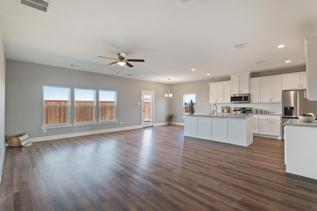 434 Cirrus Circle Muenster, TX 76252 - Photo 7 of 29 a view of kitchen with cabinets and wooden floor