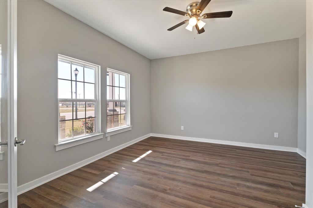 434 Cirrus Circle Muenster, TX 76252 - Photo 10 of 29 a view of a livingroom with a ceiling fan and window