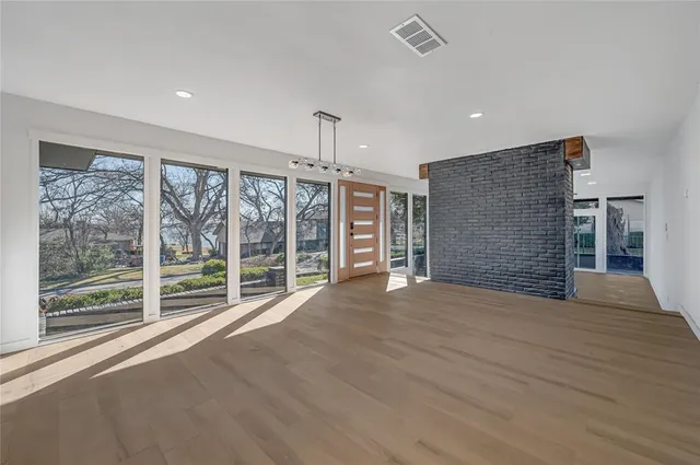 a view of an empty room with a balcony