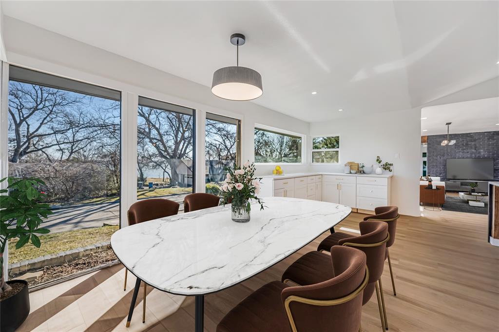 109 Pecan Drive Rowlett, TX 75087 - Photo 12 of 39 a view of a dining room with furniture window and wooden floor