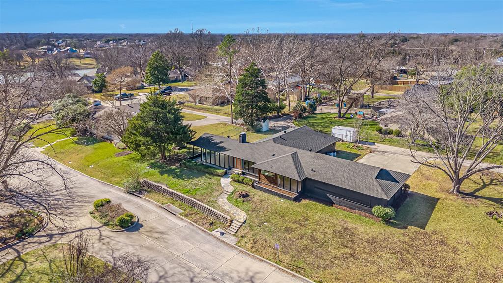 109 Pecan Drive Rowlett, TX 75087 - Photo 2 of 39 an aerial view of a house with a yard