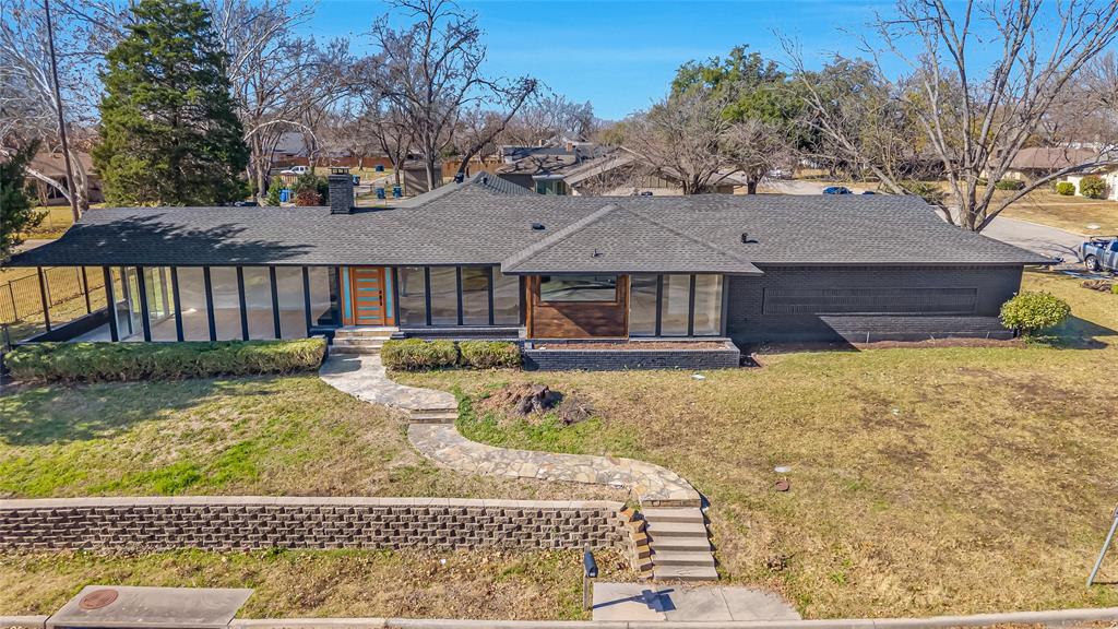 109 Pecan Drive Rowlett, TX 75087 - Photo 3 of 39 a front view of a house with garden
