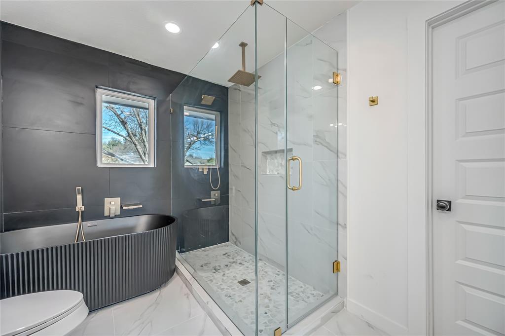 109 Pecan Drive Rowlett, TX 75087 - Photo 33 of 39 a bathroom with a double vanity sink toilet and shower