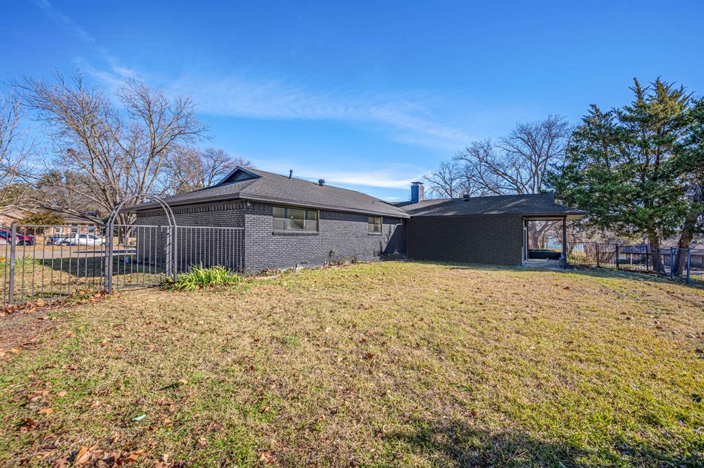 109 Pecan Drive Rowlett, TX 75087 - Photo 37 of 39 a front view of a house with a yard and covered with snow