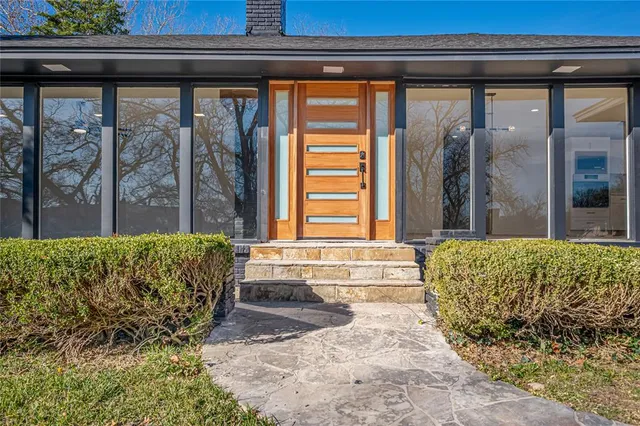 a bed sitting in front of a window