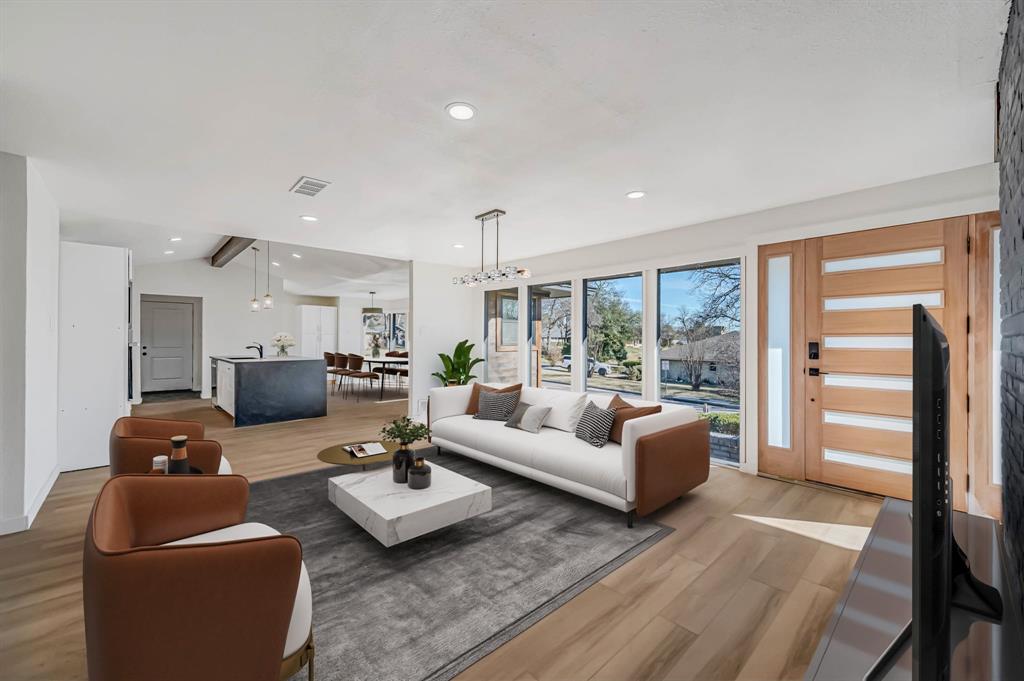 109 Pecan Drive Rowlett, TX 75087 - Photo 7 of 39 a living room with furniture and a large window