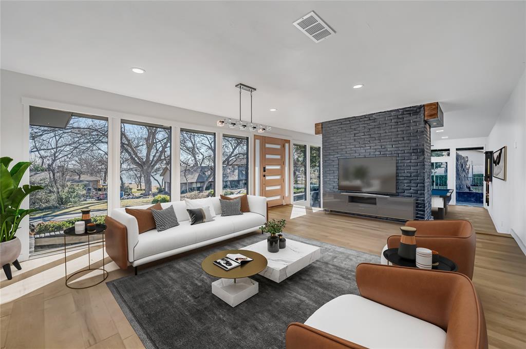 109 Pecan Drive Rowlett, TX 75087 - Photo 10 of 39 a living room with furniture fireplace and a flat screen tv