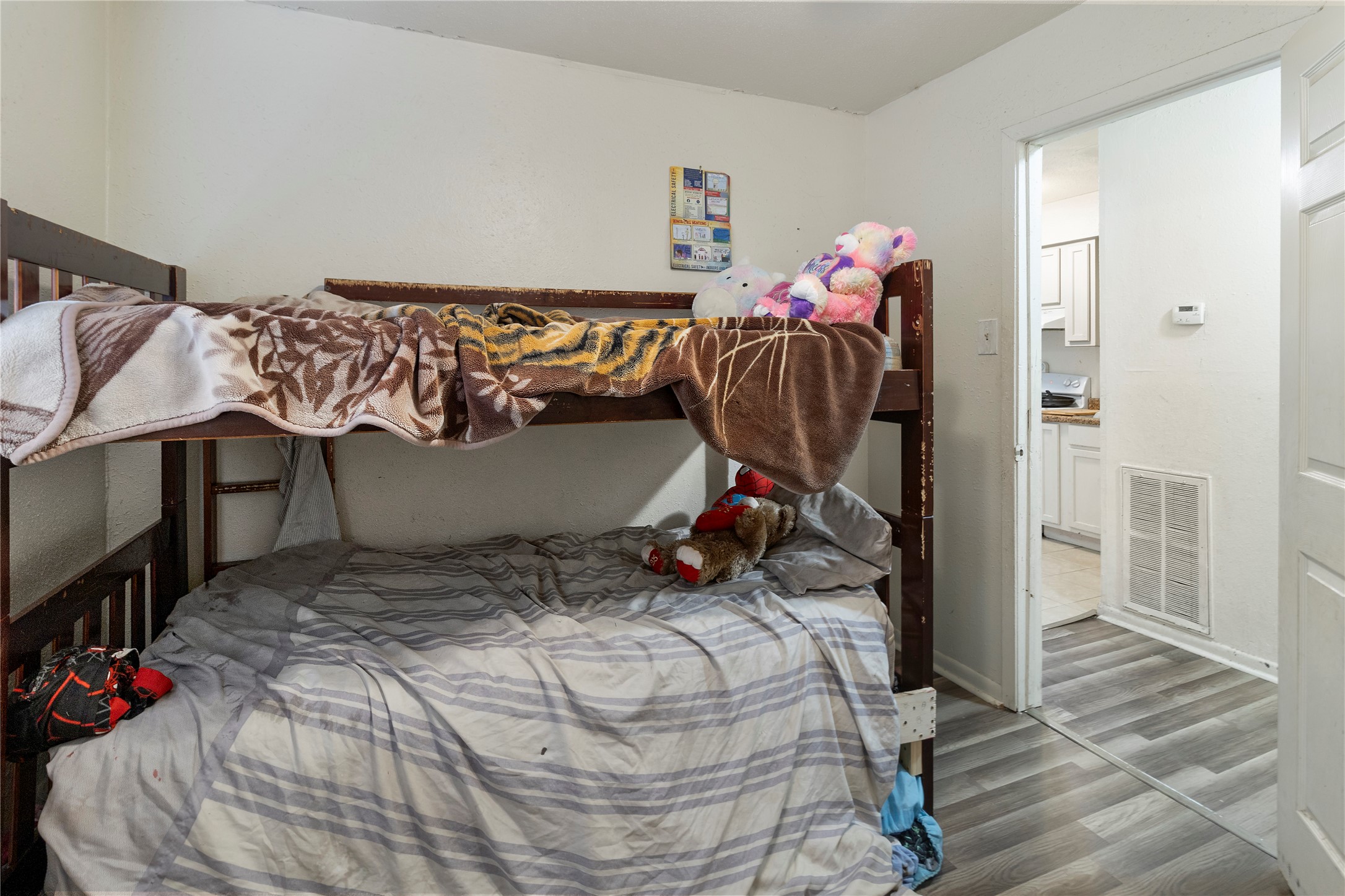 4125 Old Hearne Road Bryan, TX 77803 - Photo 17 of 21 a bed sitting in a bedroom next to a window