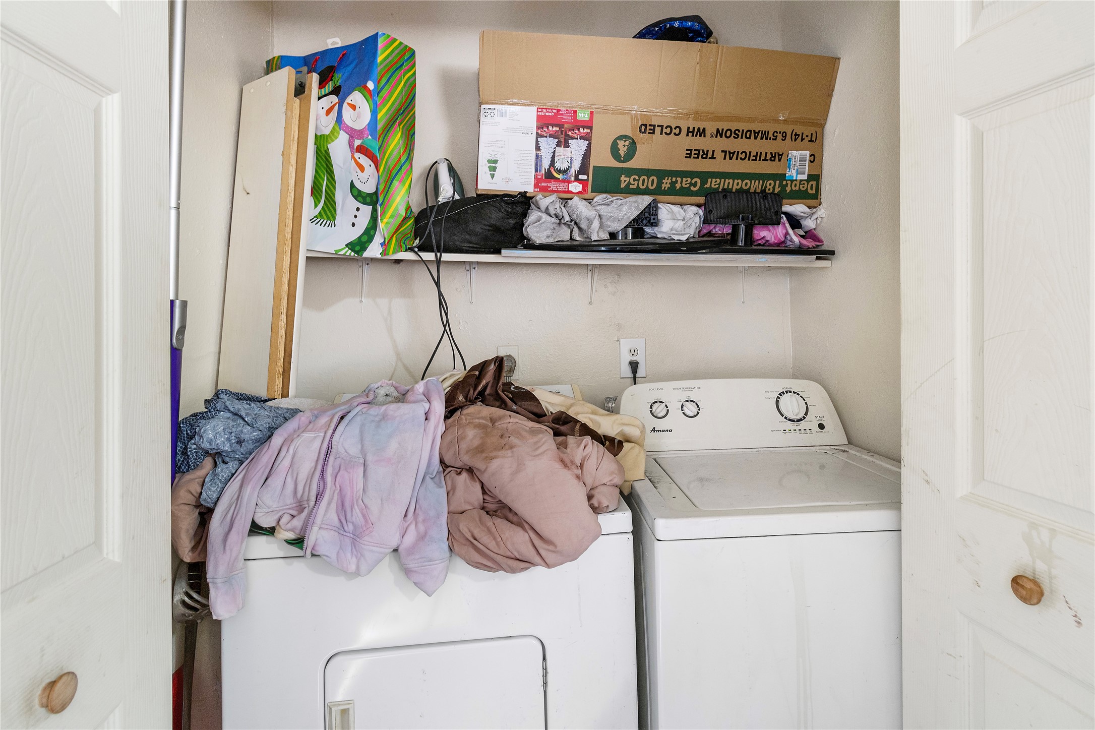 4125 Old Hearne Road Bryan, TX 77803 - Photo 20 of 21 a view of storage and utility room with washer and dryer
