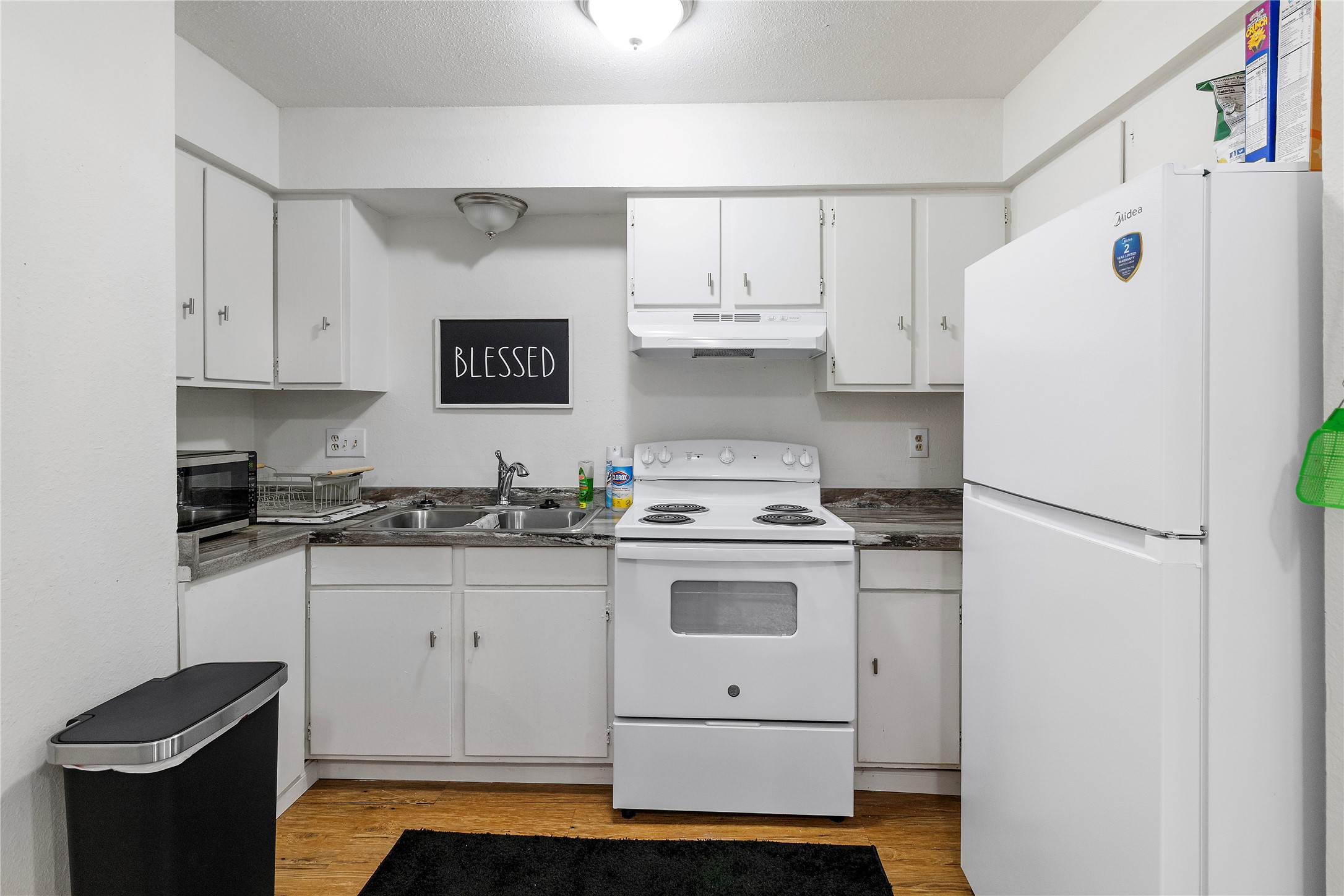 4125 Old Hearne Road Bryan, TX 77803 - Photo 4 of 21 a kitchen with stainless steel appliances a stove refrigerator sink and cabinets