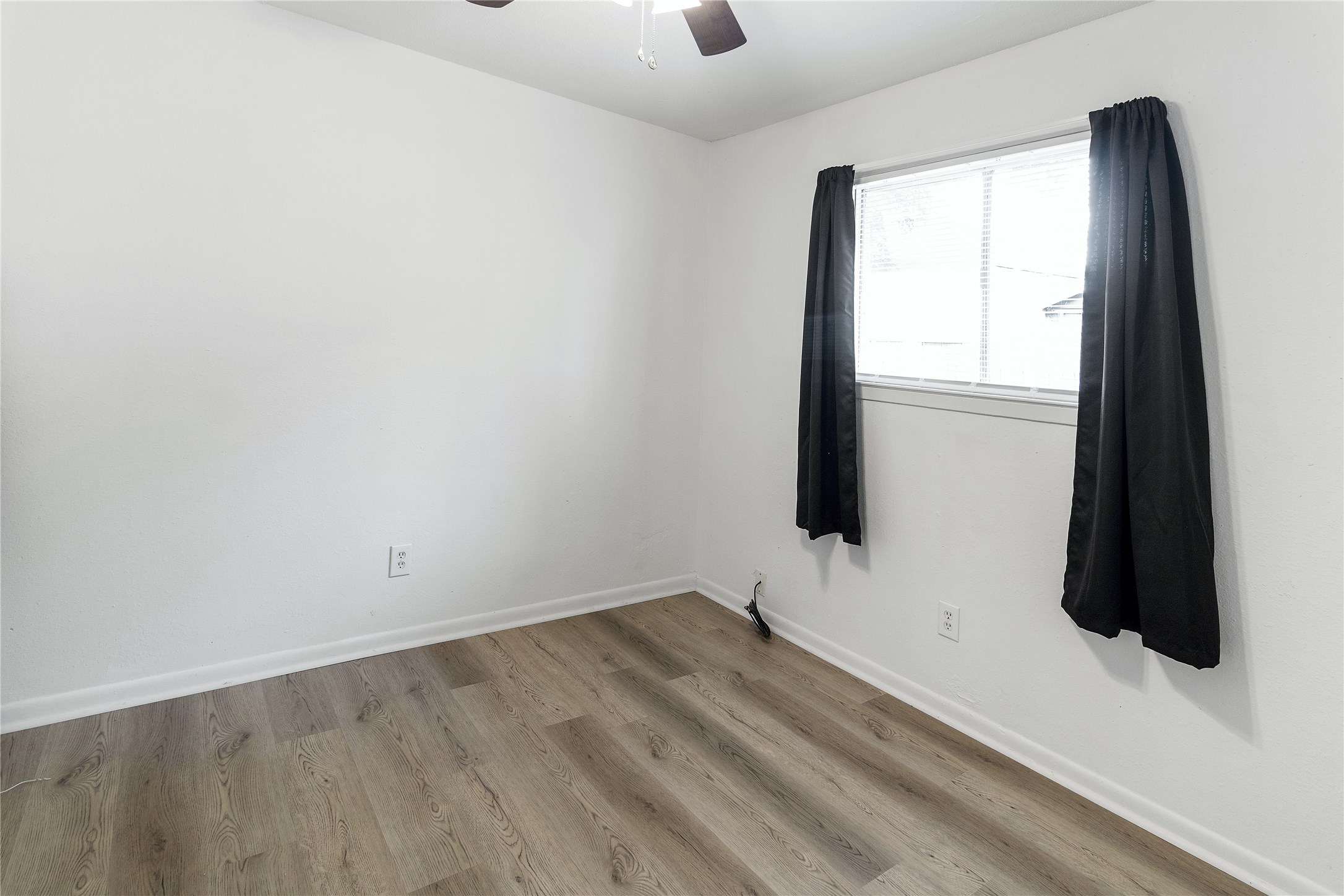 4125 Old Hearne Road Bryan, TX 77803 - Photo 8 of 21 an empty room with a window