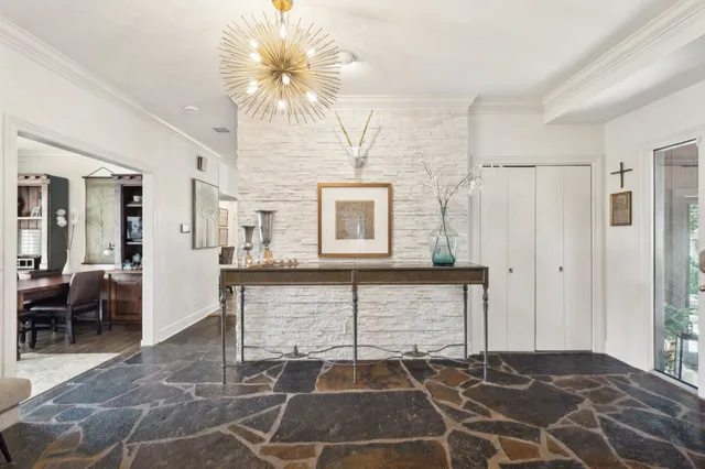 a large kitchen with a table and chairs in it