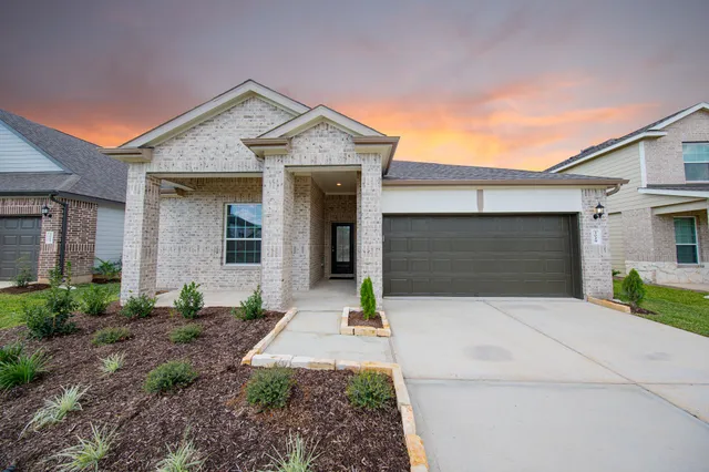 a front view of a house with yard