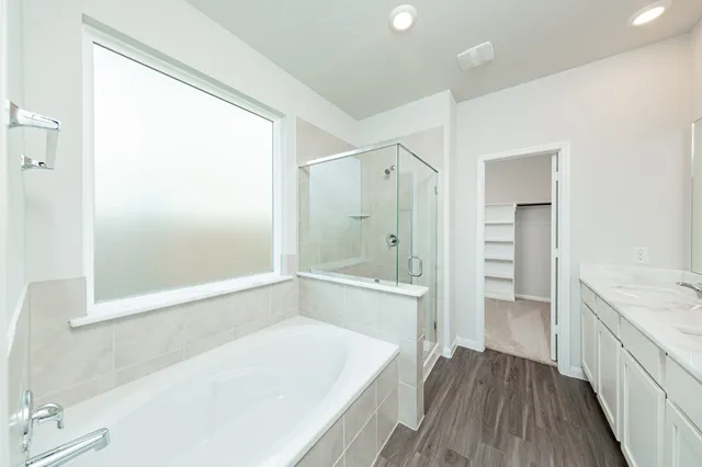 a bathroom with a bathtub and a sink