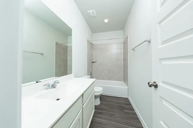 a bathroom with a sink a shower and a mirror