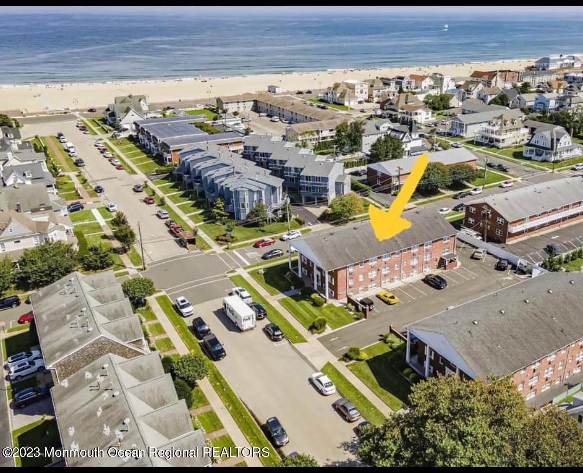 an aerial view of a house with a swimming pool