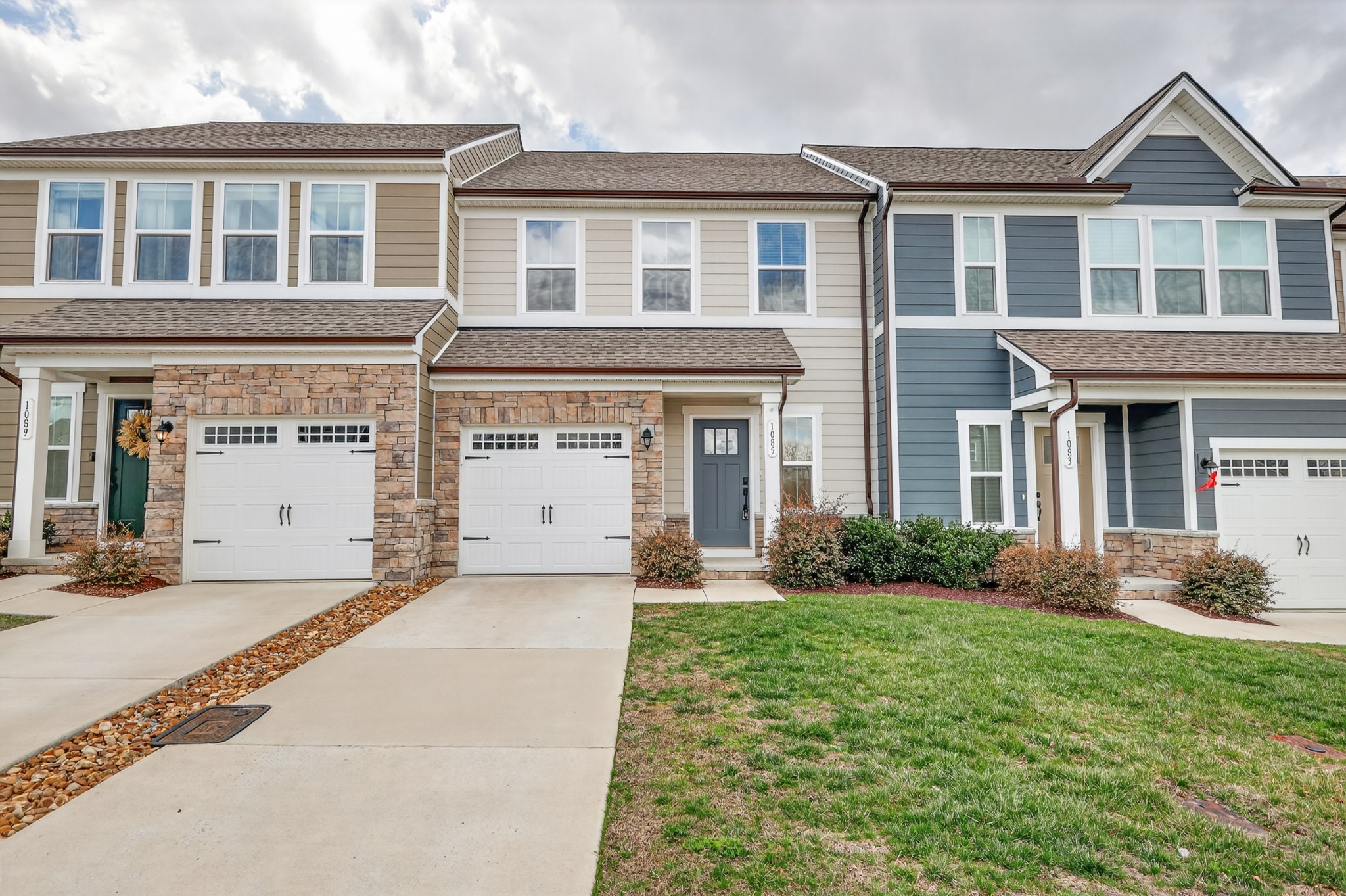 1085 Duncan Street Gallatin, TN 37066 - Photo 1 of 35 a front view of a house with garden