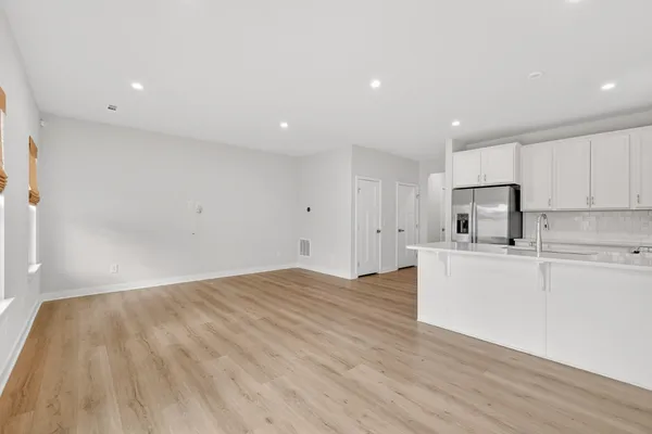 a view of kitchen with wooden floor