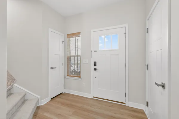 an empty room with wooden floor