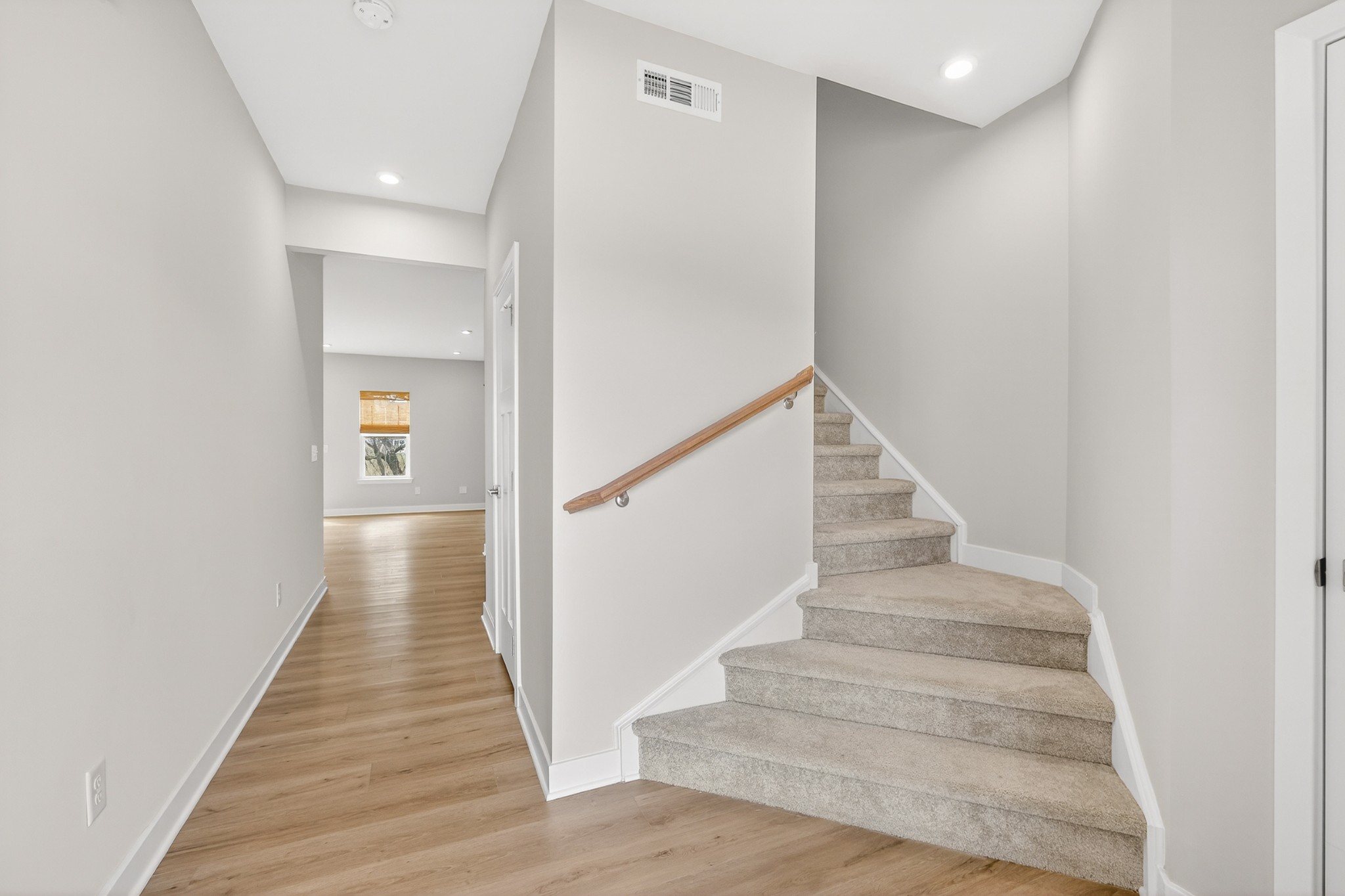 1085 Duncan Street Gallatin, TN 37066 - Photo 6 of 35 a view of staircase with wooden floor and white walls