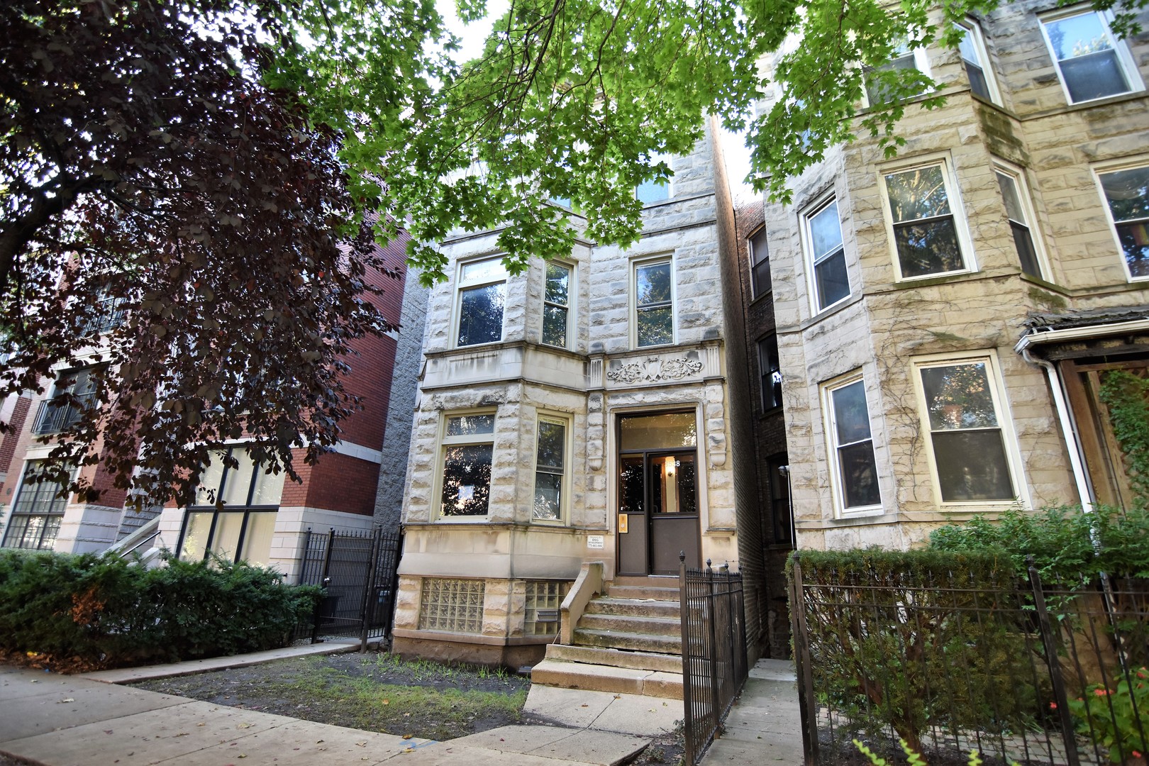 a front view of a multi story residential apartment buildings