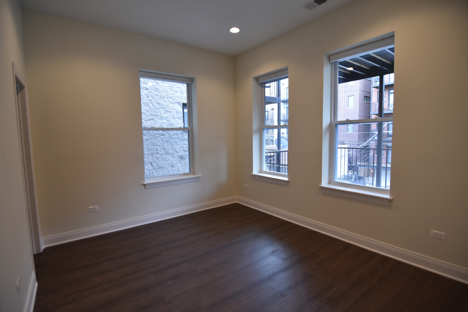 Undisclosed Address Chicago, IL 60657 - Photo 14 of 18 a view of an empty room with wooden floor and a window