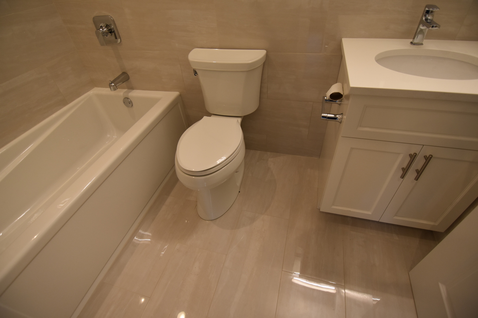 Undisclosed Address Chicago, IL 60657 - Photo 16 of 18 a bathroom with a toilet a sink and bathtub