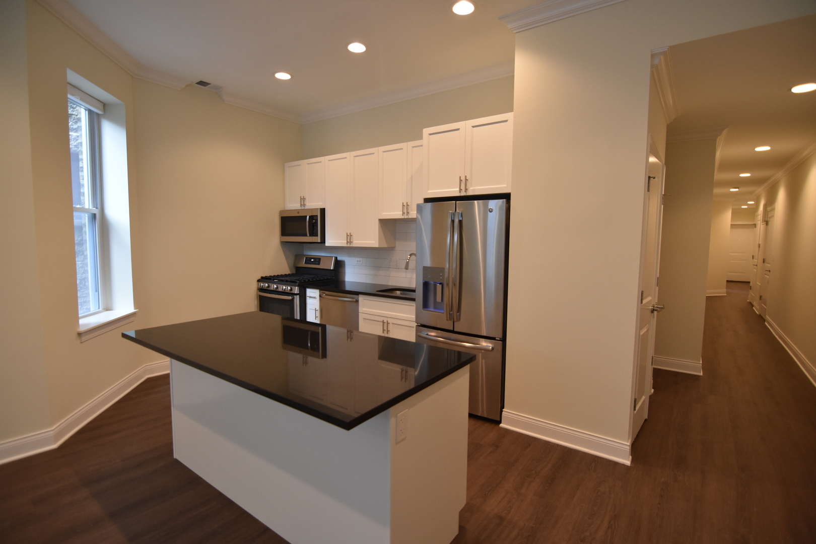 Undisclosed Address Chicago, IL 60657 - Photo 3 of 18 a kitchen with stainless steel appliances granite countertop a sink a refrigerator and a stove