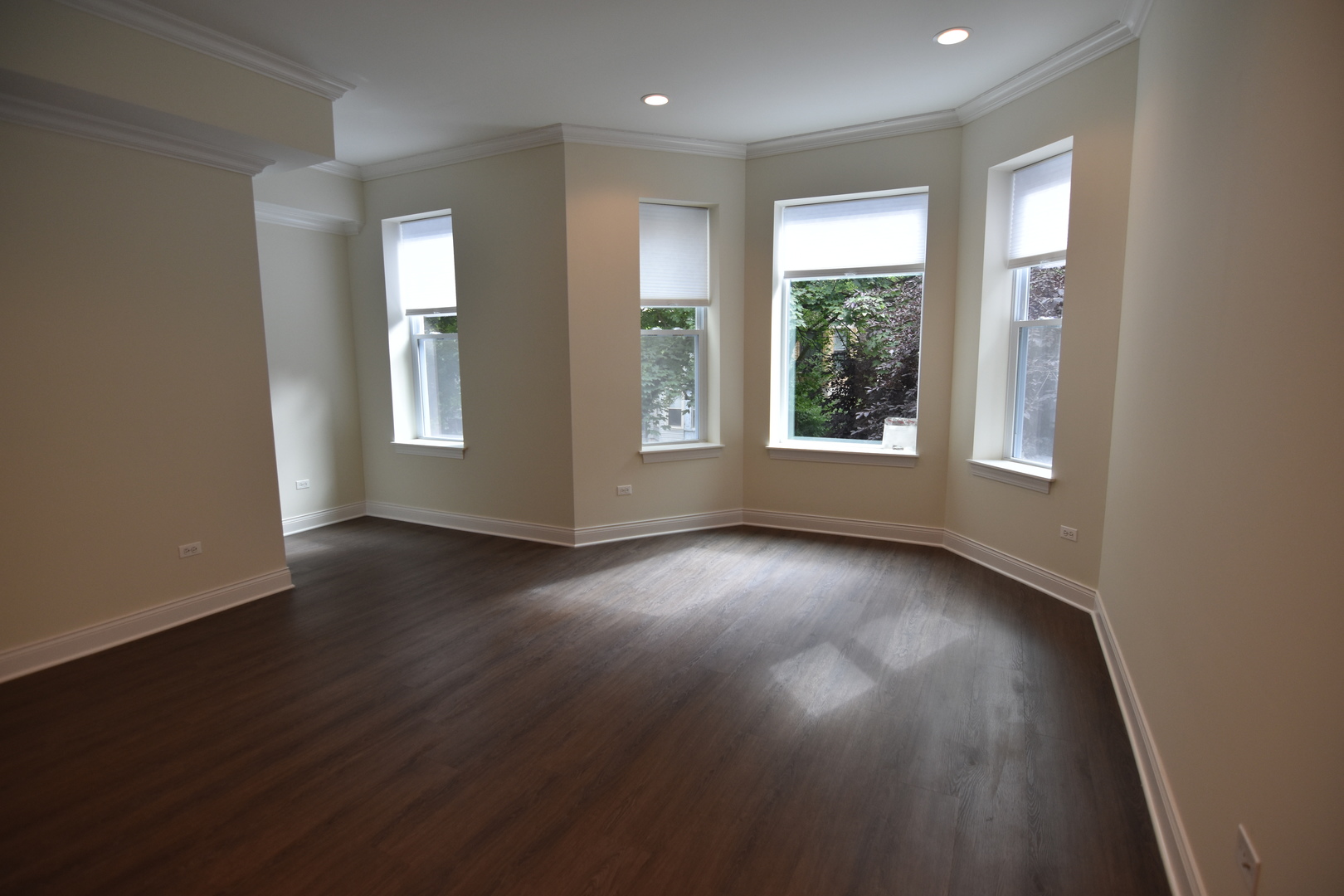 Undisclosed Address Chicago, IL 60657 - Photo 6 of 18 a view of an empty room with wooden floor and a window