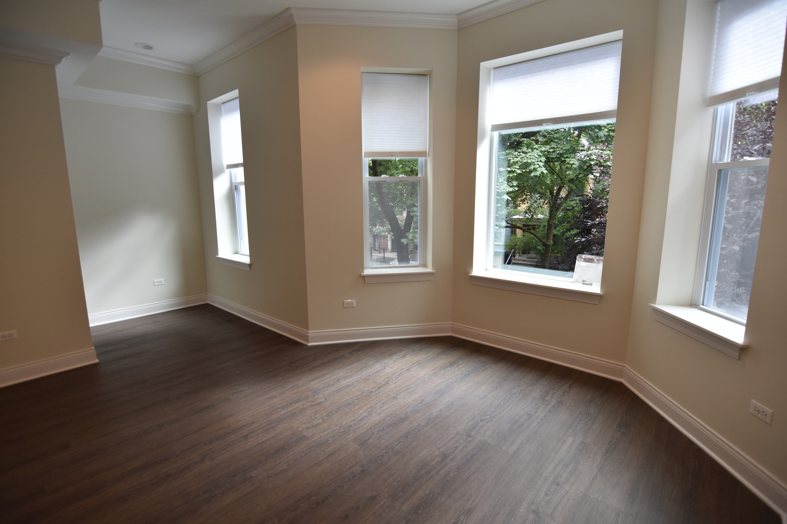 Undisclosed Address Chicago, IL 60657 - Photo 7 of 18 a view of an empty room with wooden floor and a window