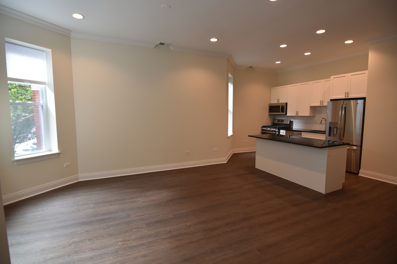 Undisclosed Address Chicago, IL 60657 - Photo 8 of 18 a kitchen with stainless steel appliances a refrigerator and a stove top oven
