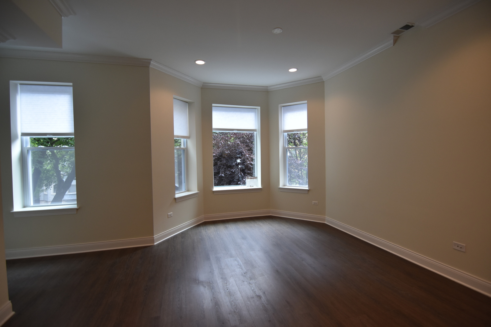 Undisclosed Address Chicago, IL 60657 - Photo 9 of 18 a view of an empty room with wooden floor and a window