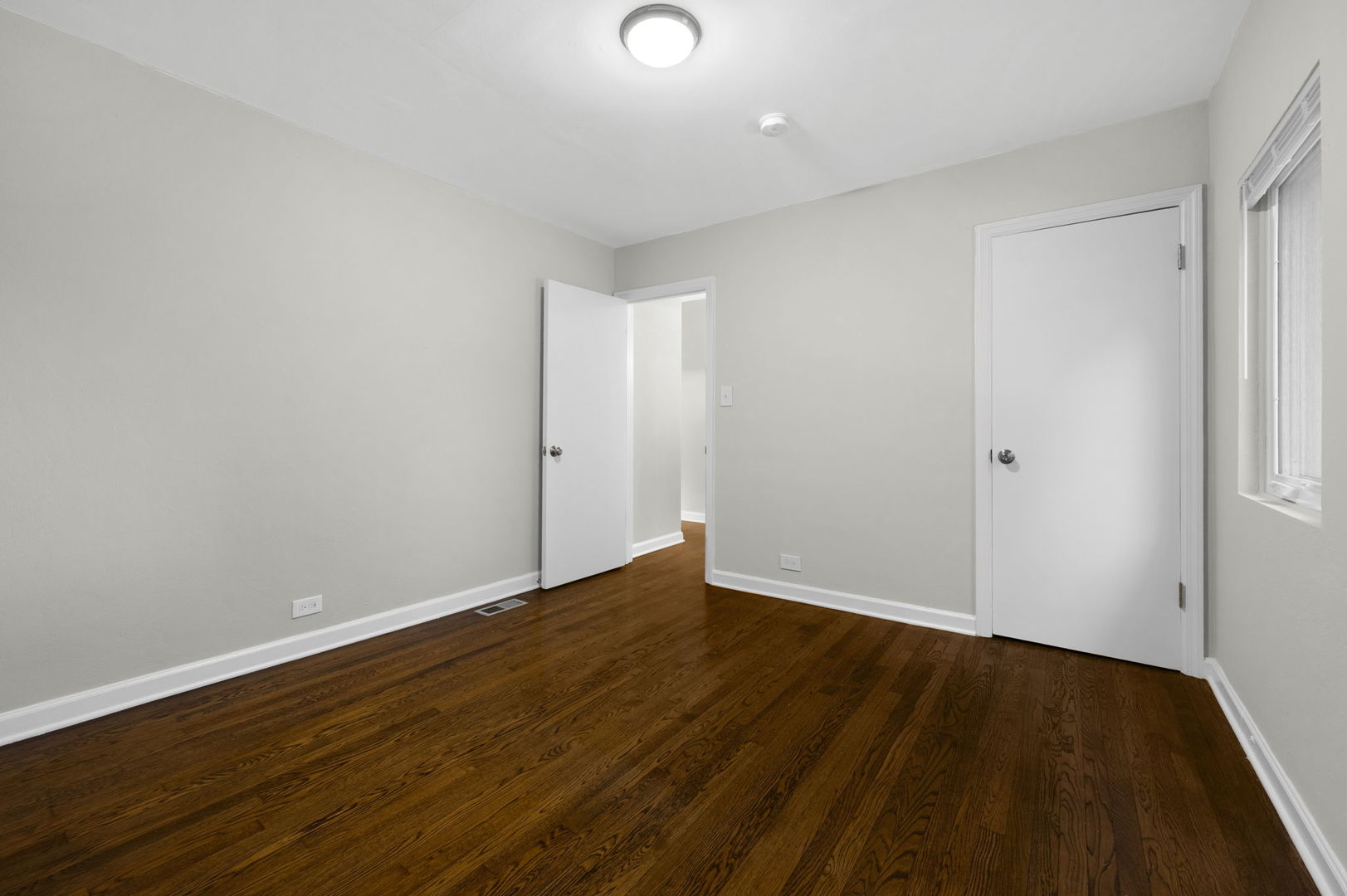 3540 Bernice Road Lansing, IL 60438 - Photo 8 of 17 a view of an empty room with wooden floor