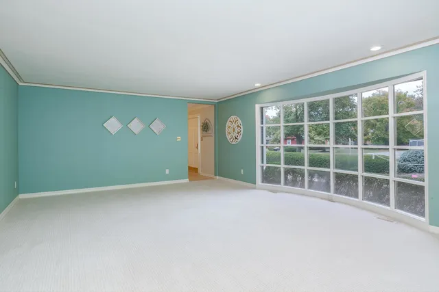 a large kitchen with stainless steel appliances granite countertop a stove a sink and a refrigerator