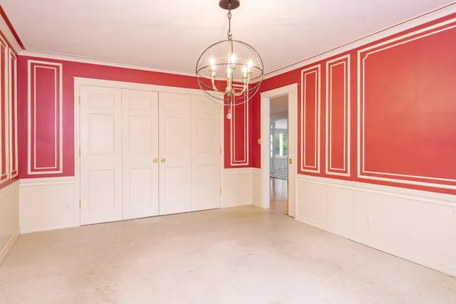 a bathroom with a double vanity sink a mirror and a bathtub