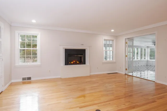 a room with kitchen island a sink cabinets and appliances