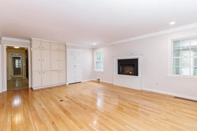 a bathroom with a toilet a sink and a mirror