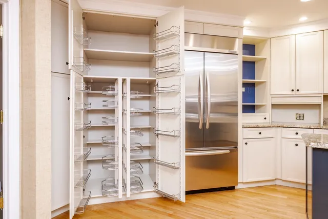 an empty room with closet area